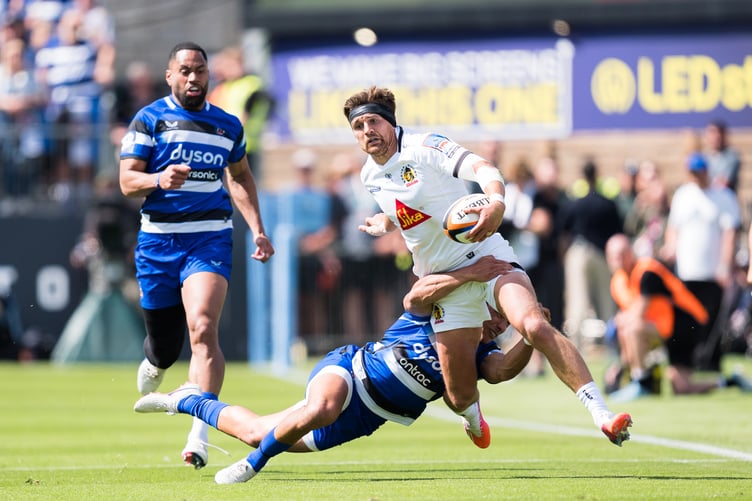 Exeter Chiefs centre Henry Slade looks to shake off a Bath tackler in Saturday's encounter