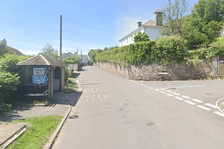 Slapton Bus Stop and sign to village shops.