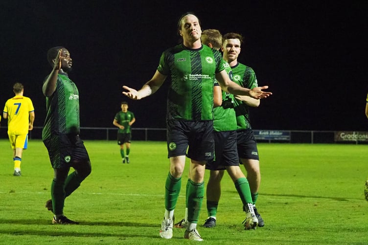 Josh Johnson celebrates scoring on his return from injury